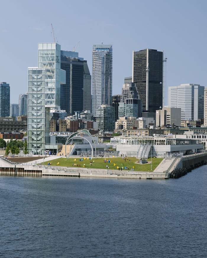 Scenic view of Montreal's skyline and waterfront under a clear sky.