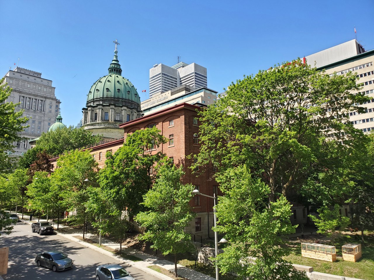 Historic architecture and greenery in Montreal's downtown area.